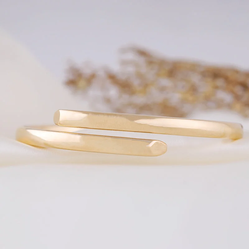 Sapphire - and - Diamond - Accented Wedding Bands in Platinum for a Royal and Sophisticated LookOval Crossover Bangle Sapphire - and - Diamond - Accented Wedding Bands in Platinum for a Royal and Sophisticated LookOval Crossover Bangle