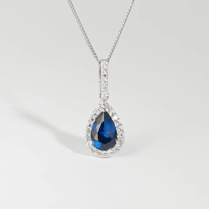 Two - Tone Gold and Silver Wedding Bands with a Twist Design for a Contemporary and Eye - Catching StyleSterling Silver Blue Pear Zirconia Halo Pendant