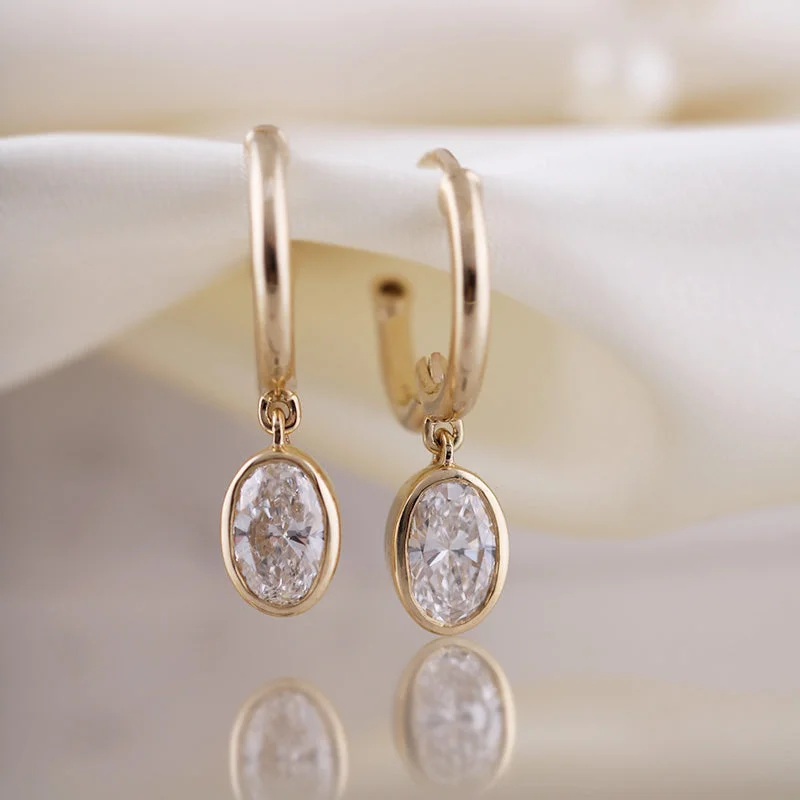Pearl - and - Diamond - Studded Wedding Bands in White Gold for a Feminine and Elegant TouchOval Cut Diamond Charm & Hoop Earrings Pearl - and - Diamond - Studded Wedding Bands in White Gold for a Feminine and Elegant TouchOval Cut Diamond Charm & Hoop Earrings