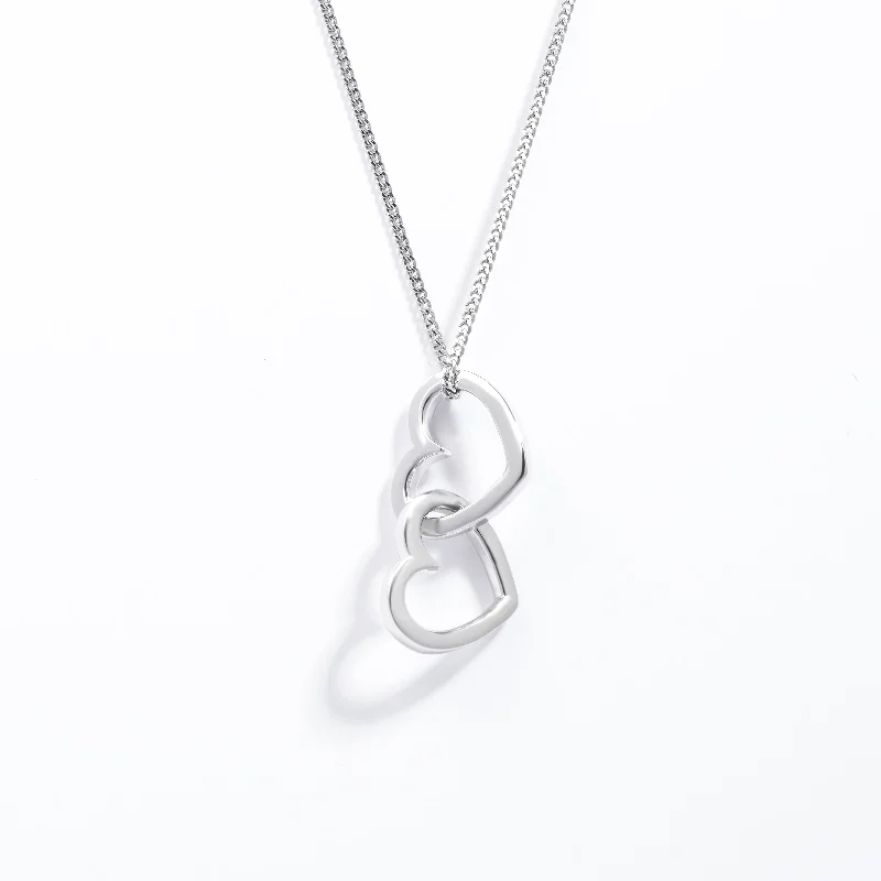 Sapphire - and - Diamond - Accented Wedding Bands in Platinum for a Royal and Sophisticated LookSterling Silver Double Interlocking Open Heart Pendant Sapphire - and - Diamond - Accented Wedding Bands in Platinum for a Royal and Sophisticated LookSterling Silver Double Interlocking Open Heart Pendant