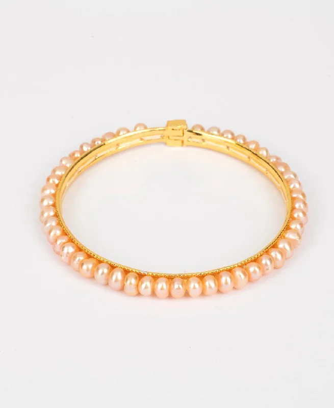 Adjustable Leather and Pearl Bracelet with Braided Detail for a Boho - Chic VibeClassy Pink Pearl Bangle Adjustable Leather and Pearl Bracelet with Braided Detail for a Boho - Chic VibeClassy Pink Pearl Bangle