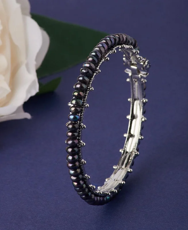 Pearl Bracelet with Zodiac Charm for a Personalized and Symbolic AccessoryElegant Rhodium Black Pearl Bangle Pearl Bracelet with Zodiac Charm for a Personalized and Symbolic AccessoryElegant Rhodium Black Pearl Bangle