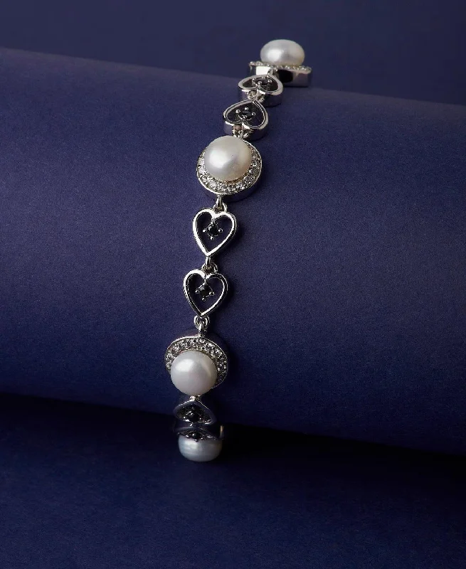 Beach - Inspired Pearl and Shell Bracelet with Seashell - Shaped Beads for a Summery LookGraceful Stone Studded Metallic Pearl Bracelet Beach - Inspired Pearl and Shell Bracelet with Seashell - Shaped Beads for a Summery LookGraceful Stone Studded Metallic Pearl Bracelet