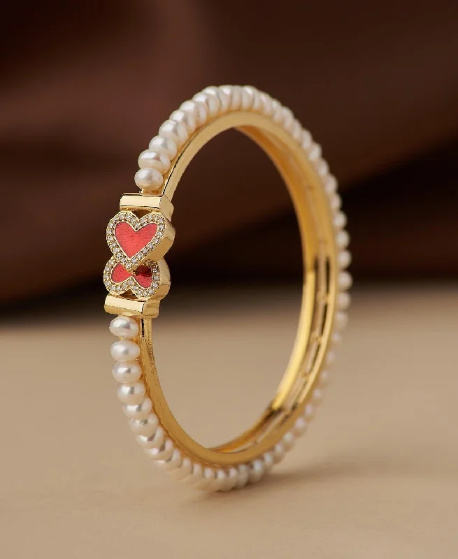 Pearl Bracelet with Hidden Magnetic Clasp for Easy and Secure WearHeart Stone Studded Pearl Bangle Pearl Bracelet with Hidden Magnetic Clasp for Easy and Secure WearHeart Stone Studded Pearl Bangle