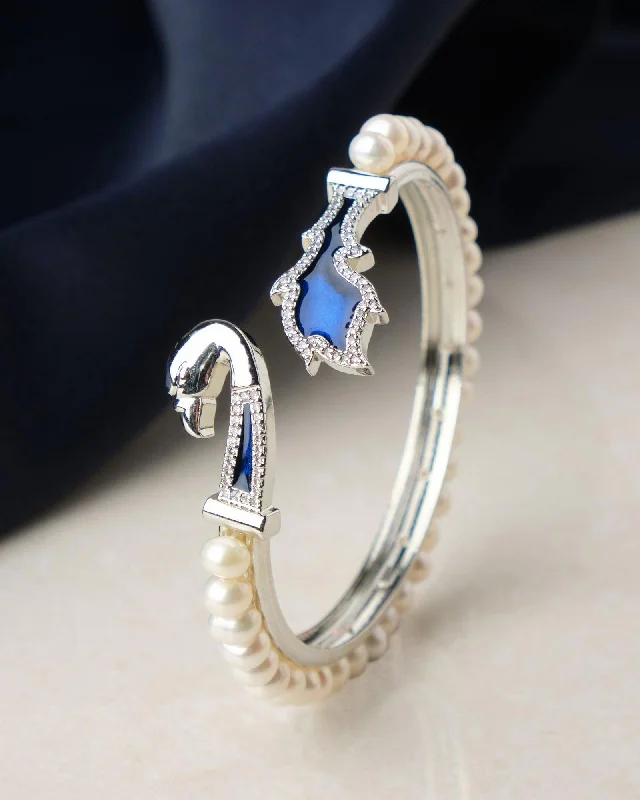 Mother - of - Pearl Inlay Pearl Bracelet with Brass Accents for a Luxurious TexturePeacock Enamel Stone Studded Pearl Bangle Mother - of - Pearl Inlay Pearl Bracelet with Brass Accents for a Luxurious TexturePeacock Enamel Stone Studded Pearl Bangle